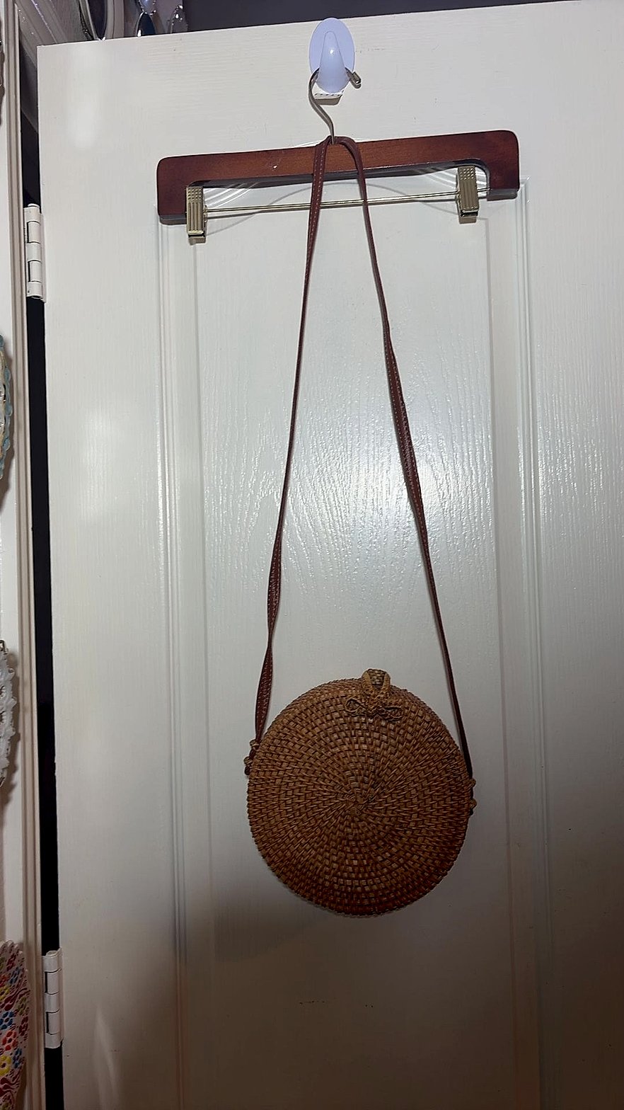 Round Woven Rattan Crossbody Bag with Floral Lining and Button-Loop Closure