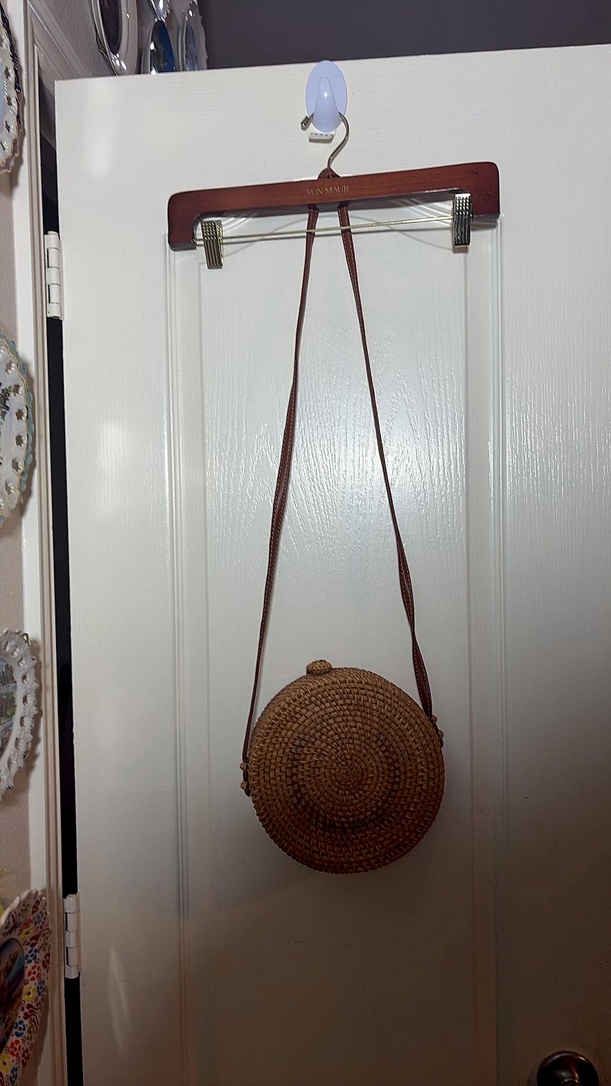 Round Woven Rattan Crossbody Bag with Floral Lining and Button-Loop Closure